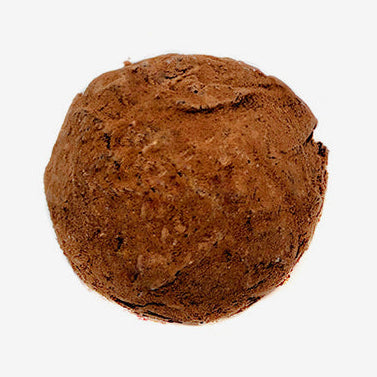 Brown truffle on a white background