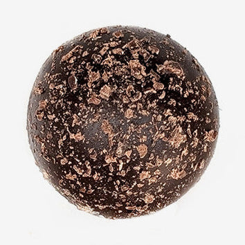 Chocolate truffle with cocoa powder on a white background
