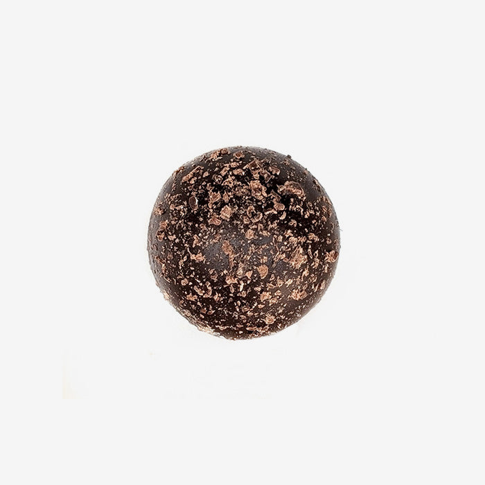 Chocolate truffle with cocoa powder on a white background