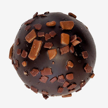 Chocolate truffle with chocolate pieces on a white background