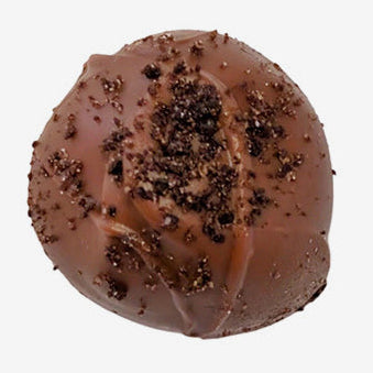 Chocolate truffle with cocoa powder on a white background
