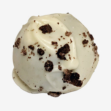 White chocolate truffle with cookie crumb pieces on a white background